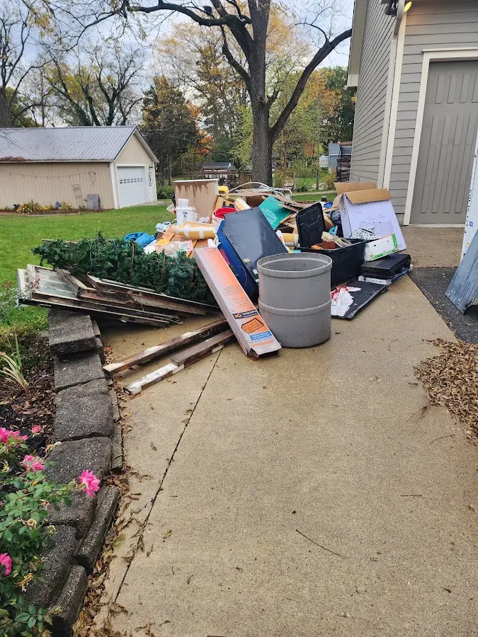 Dumpster being loaded with debris for Demolition Dumpster Rental in Fort Kent